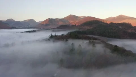 Trees poking out of mist filled valley at Derwentwater, Lake District, UK. Stock Footage 171174053