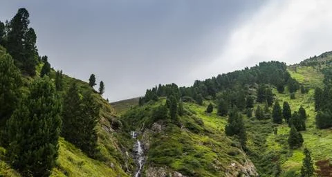 Trees in rocky mountains while hiking panorama Stock Photos