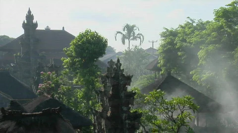 Trees stand in front of a temple in Bali, Indonesia. Stock Footage 557270