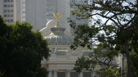Trees on the wind with theater in te background Video stock 37459438