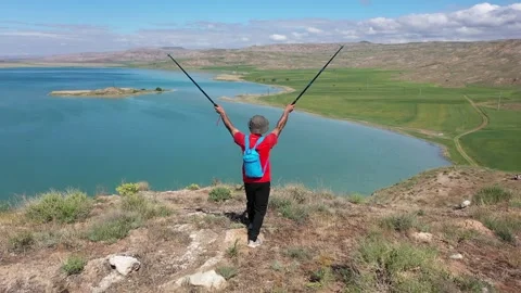 Trekker on a hill Stock Footage 294128104