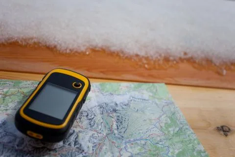 A trekker using a gps during his trip in the mountain Stock Photos