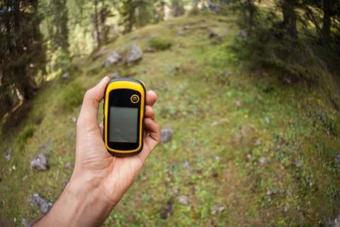 A trekker using a gps inside the forest Foto stock