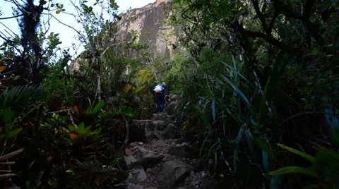 A trekker walking on Mount Roraima Stock Footage 58630740