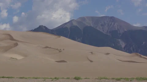 Trekkers on sand dune Stock Footage 26079103