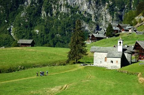 Trekkers walking along a mountain path Stock Photos