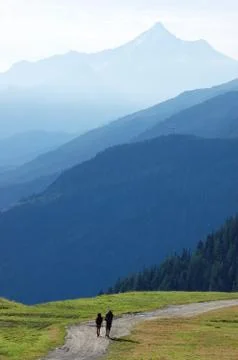 Trekkers walking along a mountain path Stock Photos