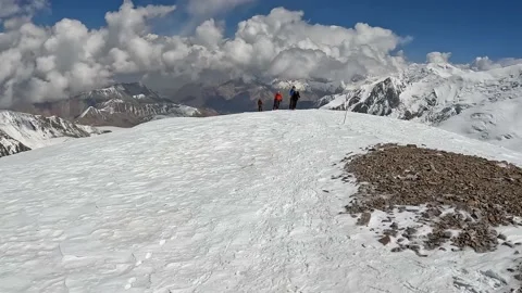 Trekking from Camp 2 to Camp 3 under Lenin Peak, Kyrgyzstan Video stock 208437664