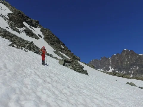 Trekking in high mountain - Hiker Stock Footage 77222802