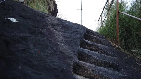 Trekking a rock with engraved steps. Stock Footage 156993604