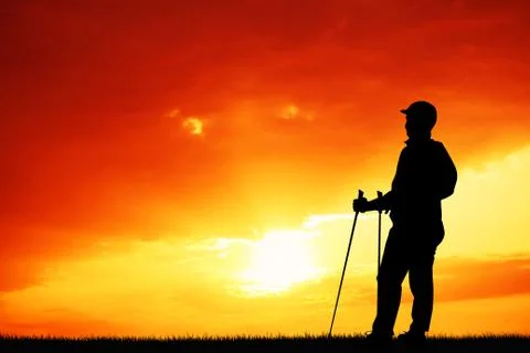 Trekking silhouette at sunset Stock Illustration