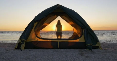 Trekking with a tent on the beach Stock Footage 83575503