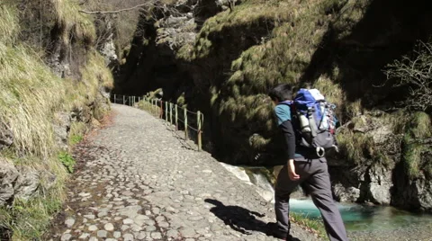 Trekking - walking on paved path, next to a river Stock Footage 49001928
