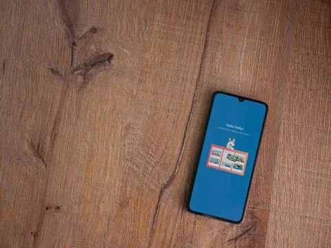Trello app launch screen with logo on the display of a black mobile smartphon Stock Photos