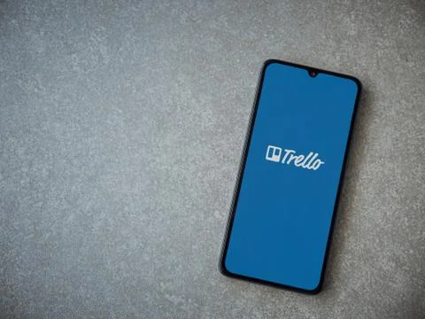 Trello app launch screen with logo on the display of a black mobile smartphon Stock Photos