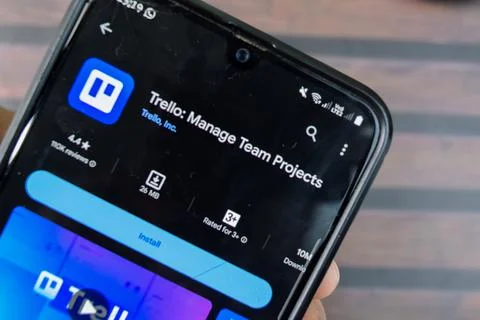 Trello - Manage Team Projects application on Smartphone screen. Photos