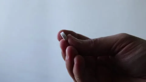 Trembling hand with the pill Stock Footage 149220125