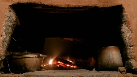 Trembling hand pulls out potatoes, the background of th rustic stove. Time lapse Stock-Footage 103568724