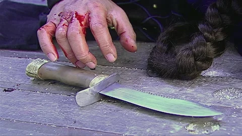 Trembling hands picking up the short knife on the deck Stock Footage 276517078