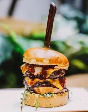 Tremendous double burger with extra cheddar cheese Stock Photos