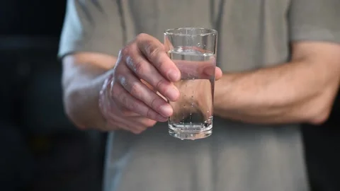 Tremor of the hands when trying to drink. Stock Footage 176332094