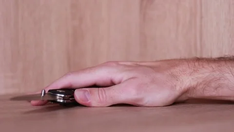 Tremored hand taking jack-knife Stock Footage 83532679