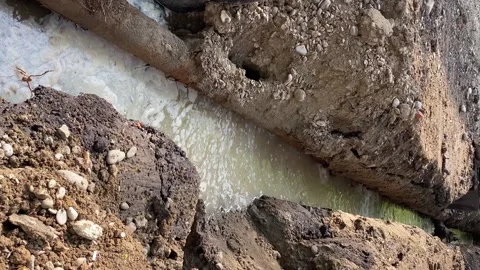 Trench filled with water, replacement of pipes and communications. Stock Footage 243719959