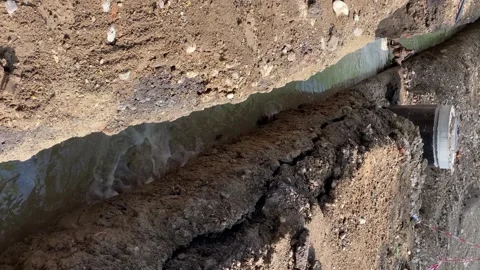 Trench filled with water, replacement of pipes and communications. Stock Footage 243719964