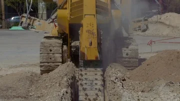 Trencher at a construction site Stock Footage 86146885