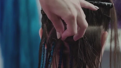 Trend-braids. Master plaits African braids with blue artificial strand Stock Footage 76582582