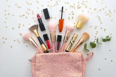 Trend cosmetics flat lay on white background. Shadows and Brushes. The contents Stock Photos