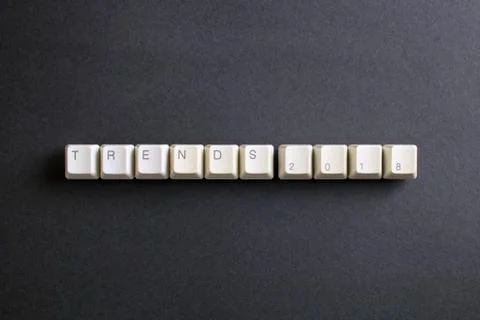 Trends 2018 concept. Flat lay view from above on computer keyboard keys. Foto stock