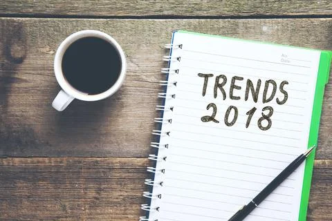 Trends 2018 text on notepad on office desk Stock Photos