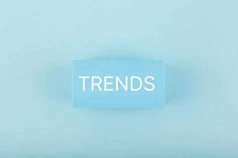 Trends written on rectangle on light blue background Stock Photos