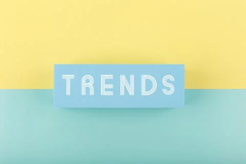 Trends written on rectangle on light multicolored yellow and aqua blue Stock Illustration
