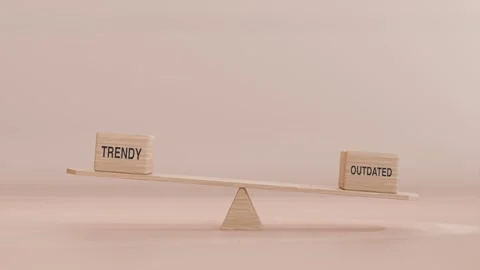 TRENDY AND OUTDATED BALANCING ON SEESAW Stock Footage 294675483