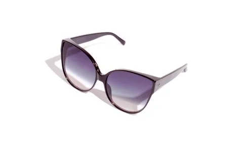 Trendy cat eye dark gradient sunglasses in fine black plastic frame. Stock Photos