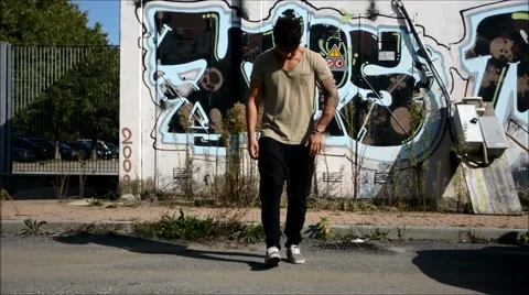 Trendy cool young man doing break dance in the street Stock Footage 43201107