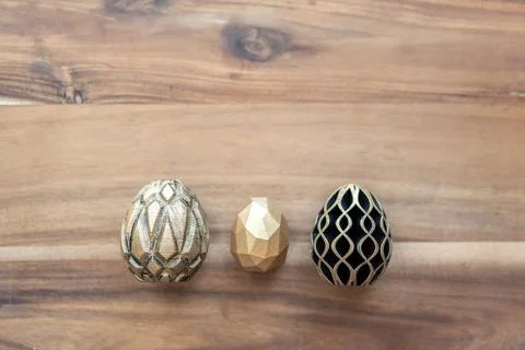 Trendy Easter low poly decor. Golden and black eggs of geometric style. Happy Stock Illustration