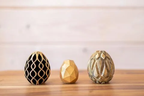 Trendy Easter low poly decor. Golden and black eggs of geometric style. Happy Stock Illustration