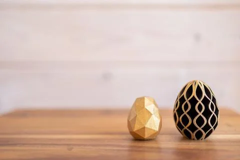 Trendy Easter low poly decor. Golden and black eggs of geometric style. Happy Stock Illustration