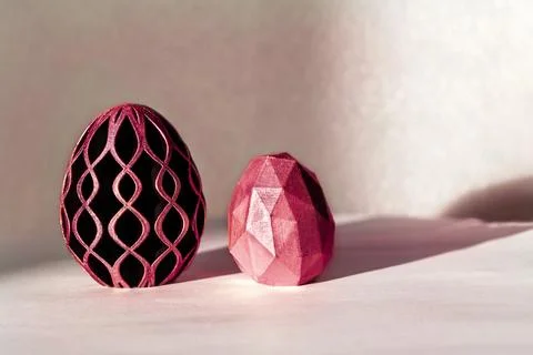 Trendy Easter low poly decor design of 2023. Eggs of geometric style in toning Stock Photos