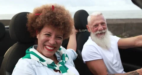 Trendy elderly couple having fun doing a road trip during vacation Stock Footage 153403415