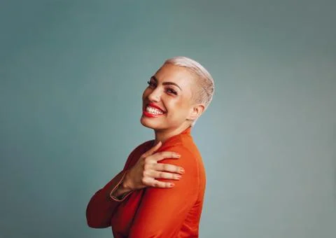 Trendy female model with a blonde pixie hairstyle Stock Photos