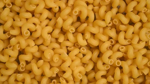 Trendy flat view closeup yellow macaroni. Stock Footage 163094982