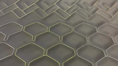 Trendy geometric pattern on dark background with yellow white and orange Stock Photos
