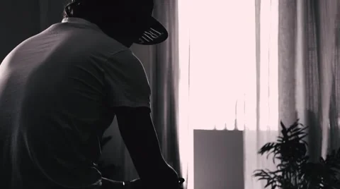 Trendy guy with the phone. Section and goes to take a bath . Stylish interior 스톡 동영상 62096016