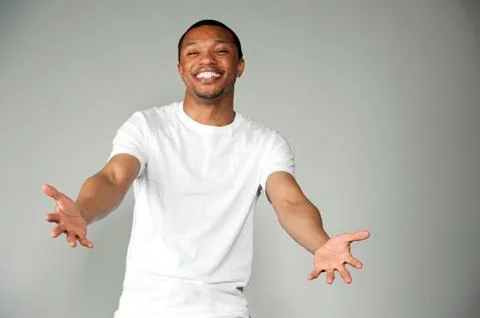 Trendy Happy and Fun Black Male Wearing A White Top Stock Photos
