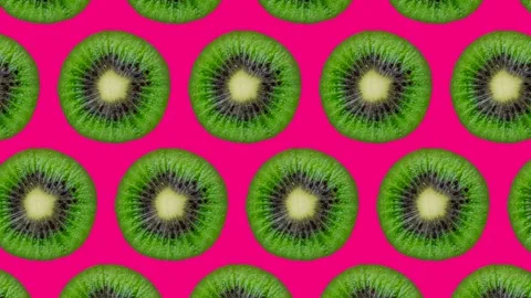 Trendy looping food animation or background or pattern of half kiwi shaking or Stock Footage 248962896