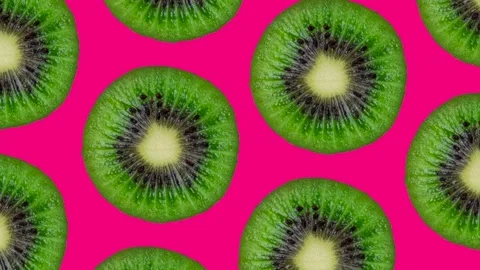 Trendy looping food animation or background or pattern of half kiwi shaking or Stock Footage 252201096